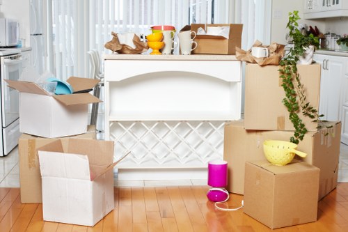 Careful wrapping of fragile household items during a packing service