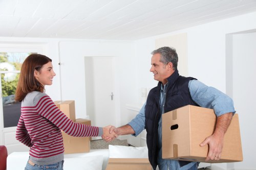 Furniture and boxes being prepared for transport by movers in Westwimbledon