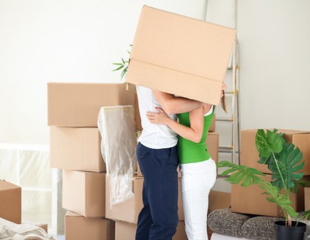Packed moving boxes and furniture ready for transport