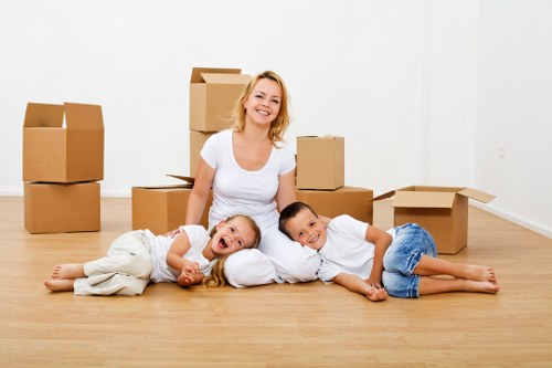 Professional movers transporting household items in West Wimbledon