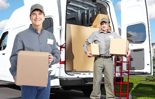 Team unloading business contents at a new Westwimbledon premises