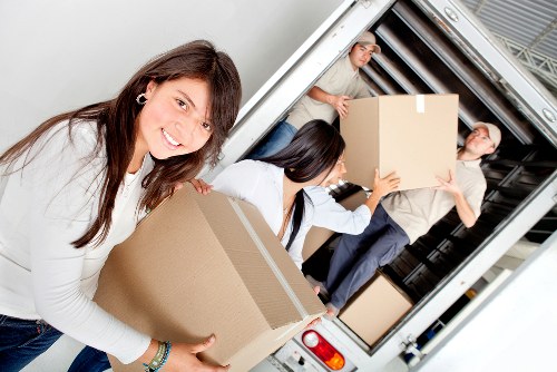 Careful loading of household furniture for a move in Westwimbledon