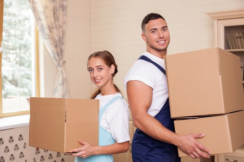 Packed moving boxes and labelled items prepared for a local removal service