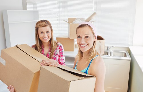 Movers handling furniture during a local Westwimbledon property move